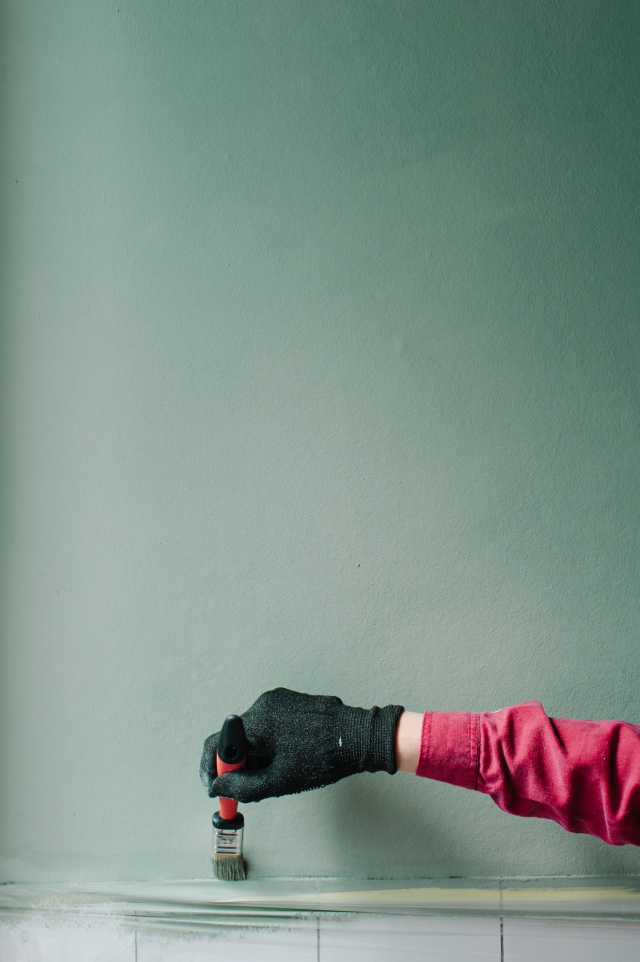 Hand painting green wall